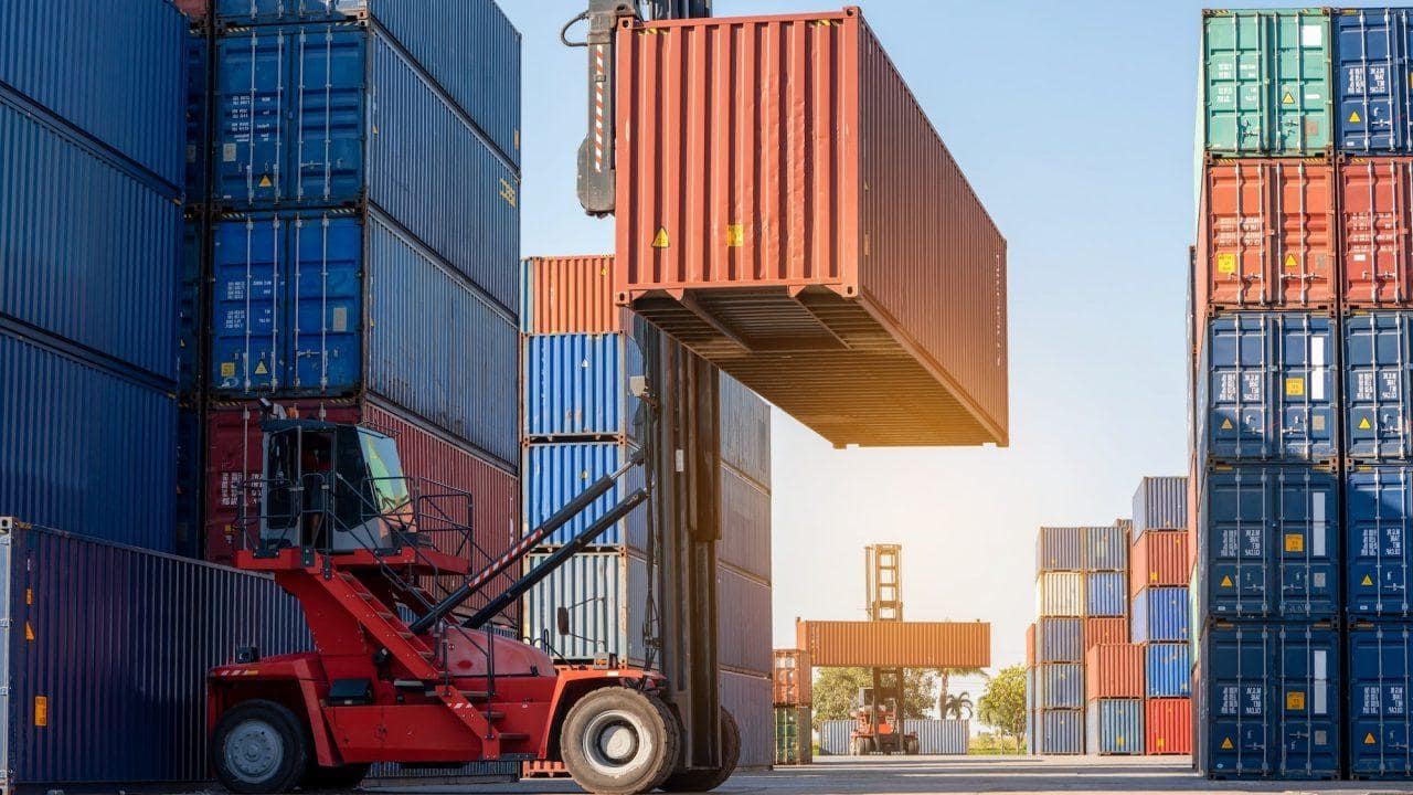 Forklift working in the container cargo yard port loading cargo tank logistic service and transport e1665466492906.jpg